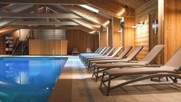 A wooden interior with a swimming pool, sun loungers, and a staircase.