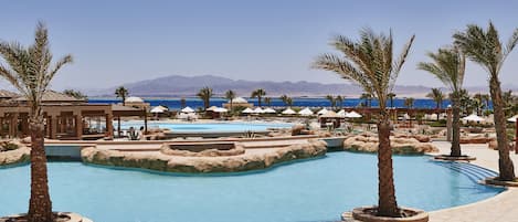 Indoor pool, outdoor pool, open 9:00 AM to 6:00 PM, pool umbrellas