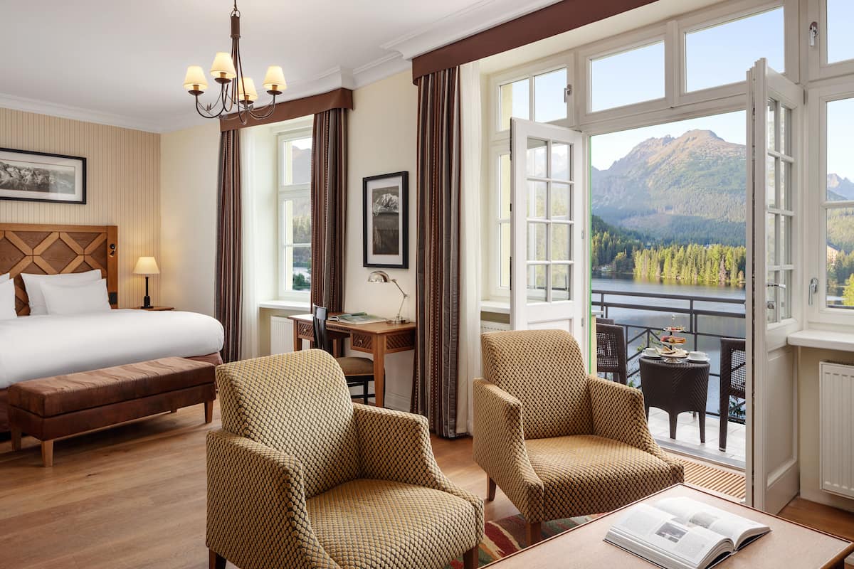 junior room, bathtub, mountain view (lake view junior suite) | premium bedding, down duvets, minibar, in-room safe