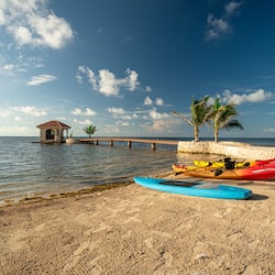 On the beach, white sand, sun loungers, beach umbrellas