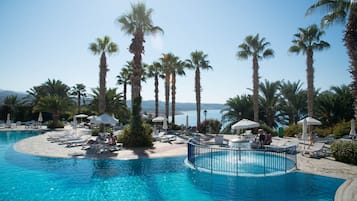 Indoor pool, outdoor pool, pool umbrellas, sun loungers