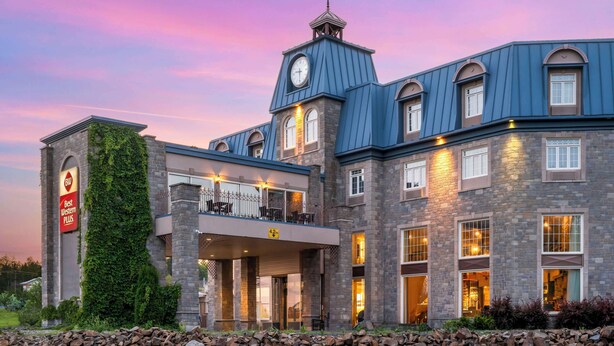 A large, multi-story hotel with a prominent clock tower and a sign reading "Best Western Plus." - Best Western Plus Edmundston Hotel (Edmundston)