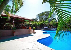 Outdoor pool, pool umbrellas, sun loungers
