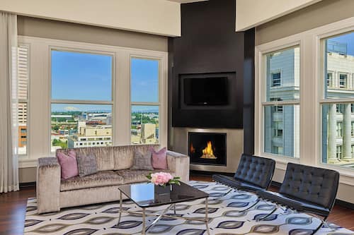 Presidential Suite, 1 Bedroom | Living room | 50-inch flat-screen TV with cable channels, TV, iPod dock