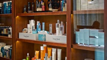 A display of various skincare products on shelves.