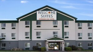 A hotel with a sign reading "Welcome Suites Extended Stay Hotel". - Welcome Suites (O'Fallon)