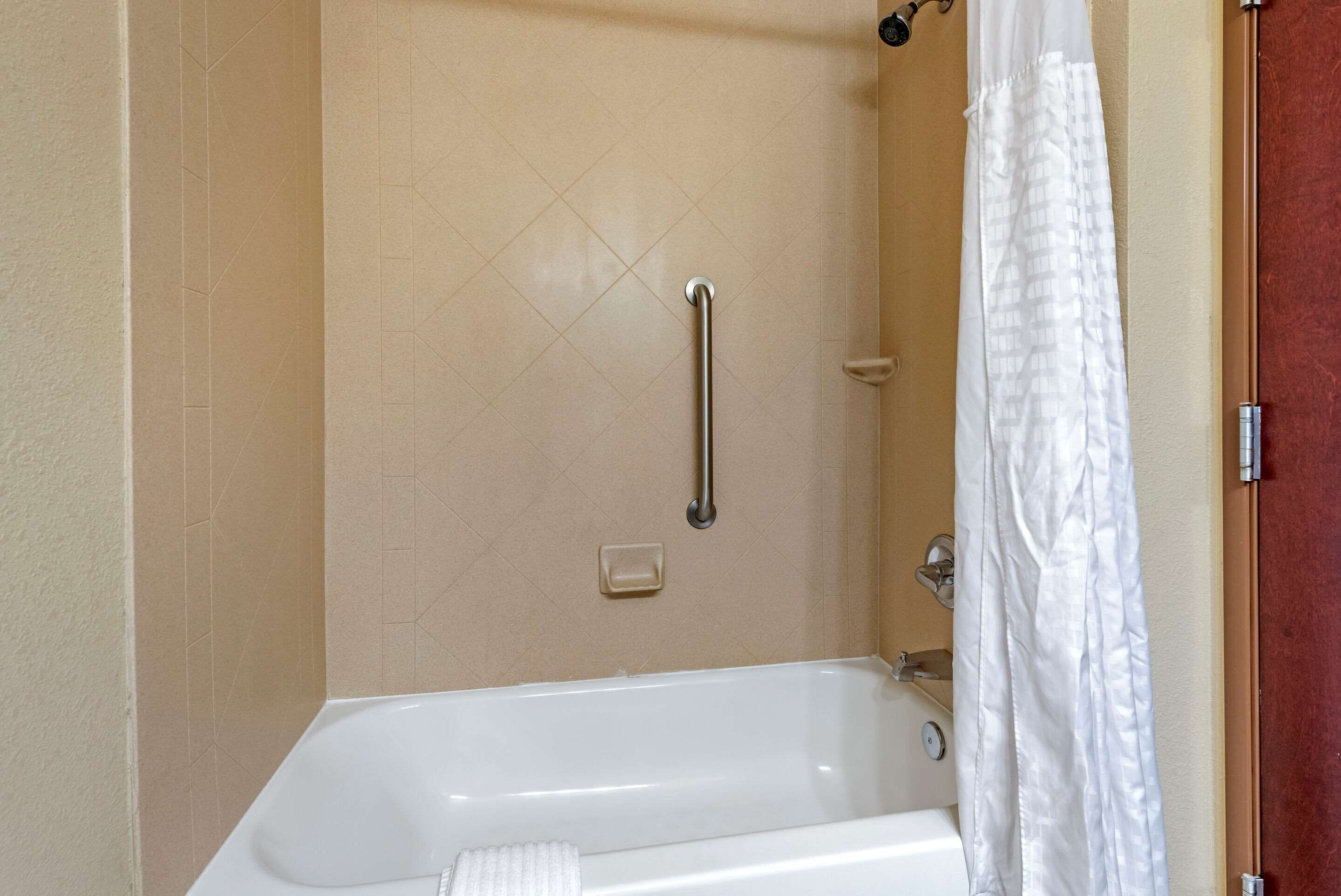 premium bedding, pillow-top beds, desk, blackout curtains