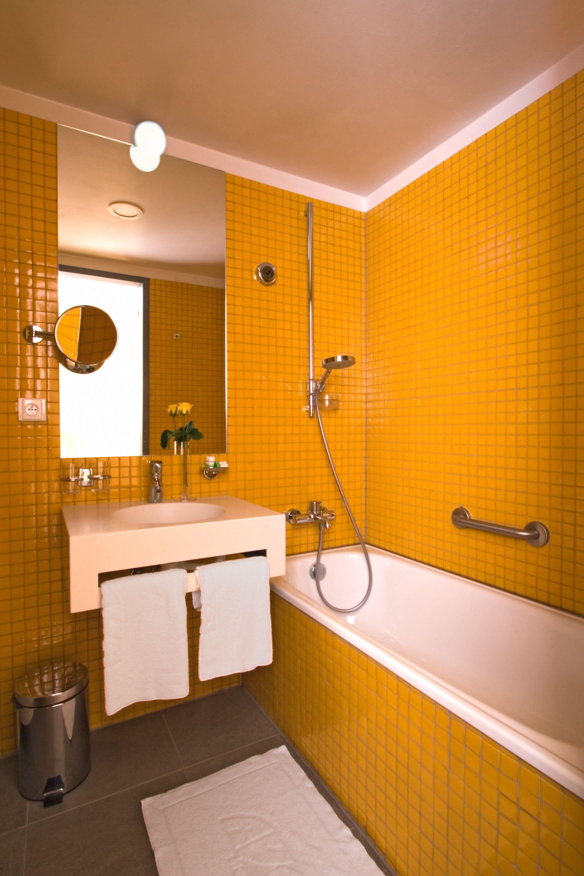 designer toiletries, hair dryer, towels