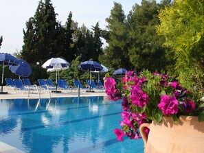 Indoor pool, seasonal outdoor pool, pool umbrellas, pool loungers