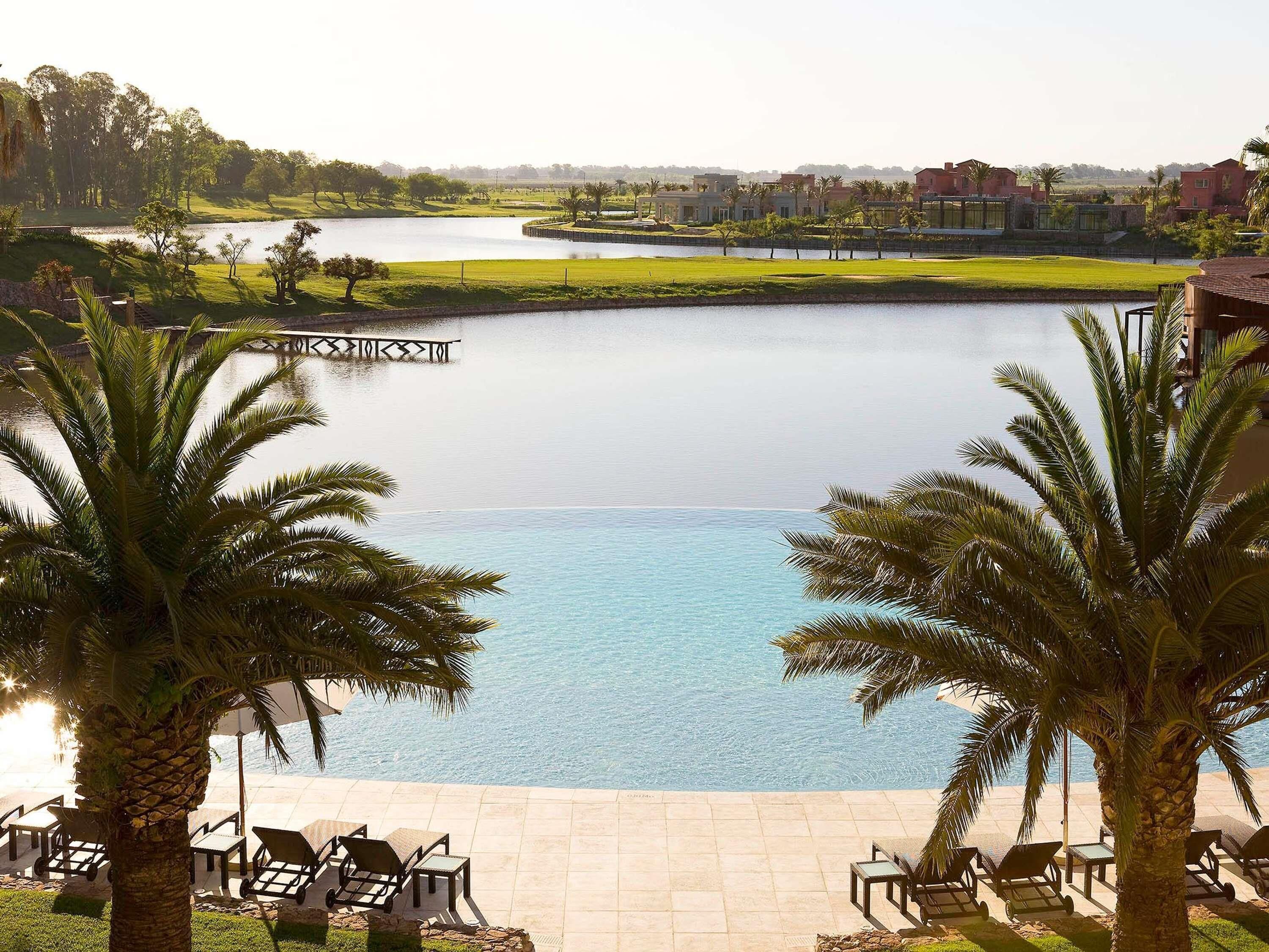 Indoor pool, outdoor pool, pool umbrellas, pool loungers