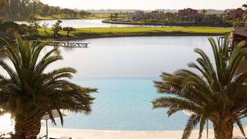 Indoor pool, outdoor pool, pool umbrellas, pool loungers