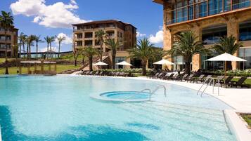 Indoor pool, outdoor pool, pool umbrellas, pool loungers