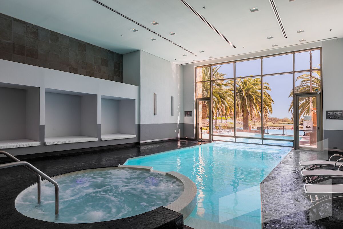 indoor pool, outdoor pool, pool umbrellas, pool loungers