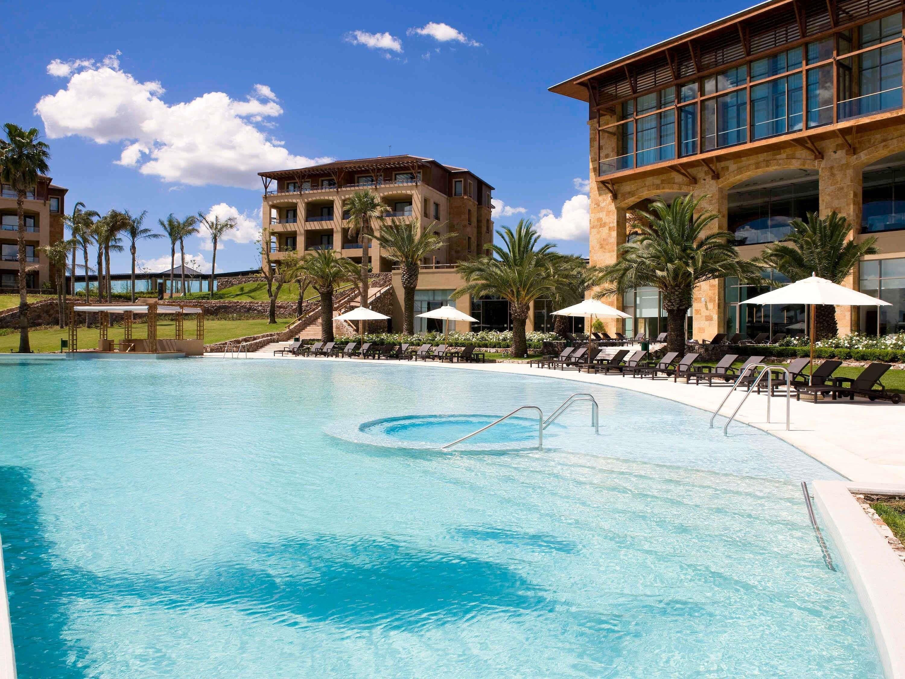 Indoor pool, outdoor pool, pool umbrellas, sun loungers