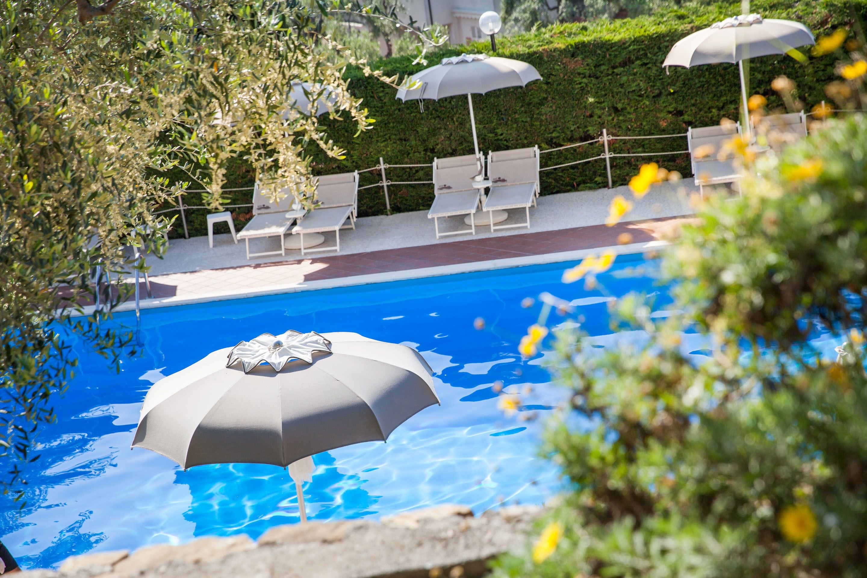 seasonal outdoor pool, pool umbrellas, pool loungers