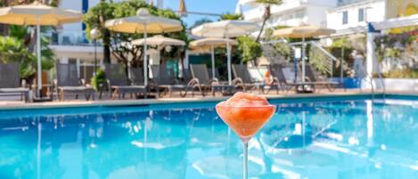 Outdoor pool, pool umbrellas, pool loungers