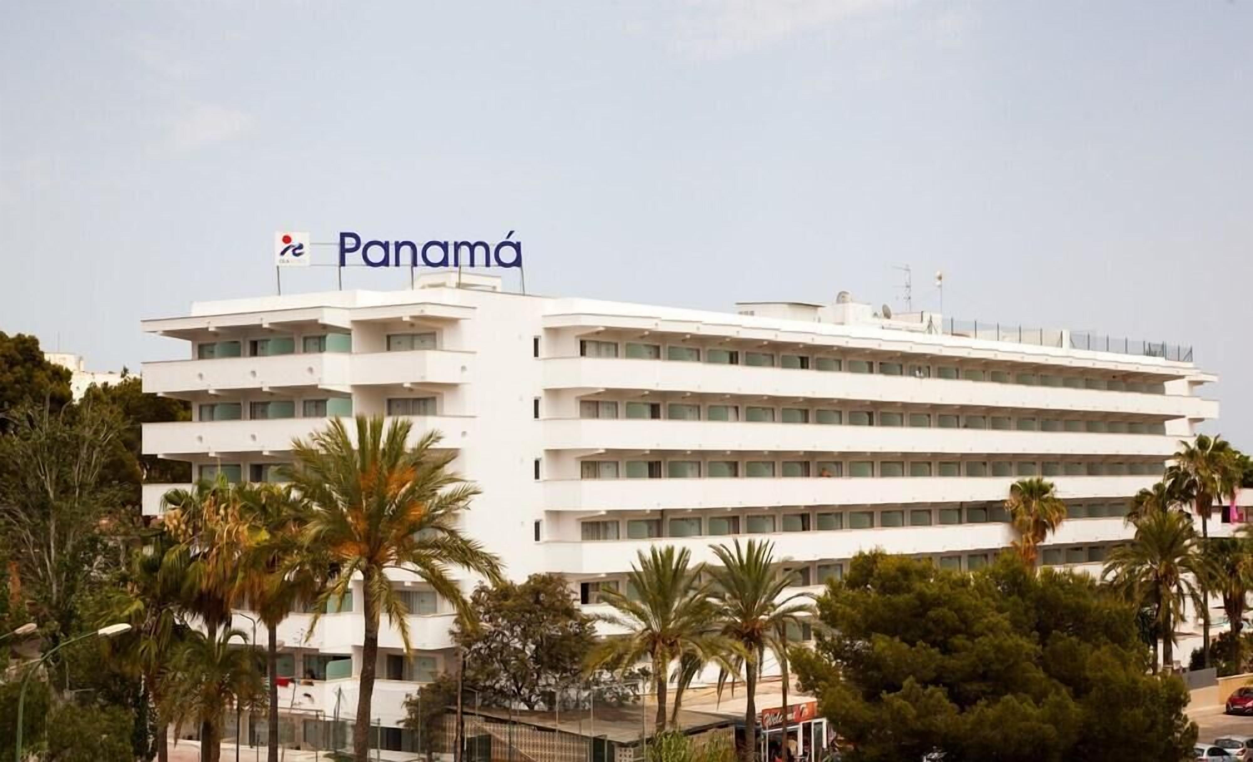 A modern multi-story building with a prominent "Panama" sign on the top.