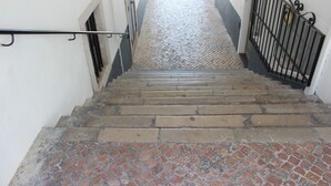 A staircase with stone steps and metal railings, leading to a higher floor. - Hotel Ordem de Santiago (Alcacer do Sal)
