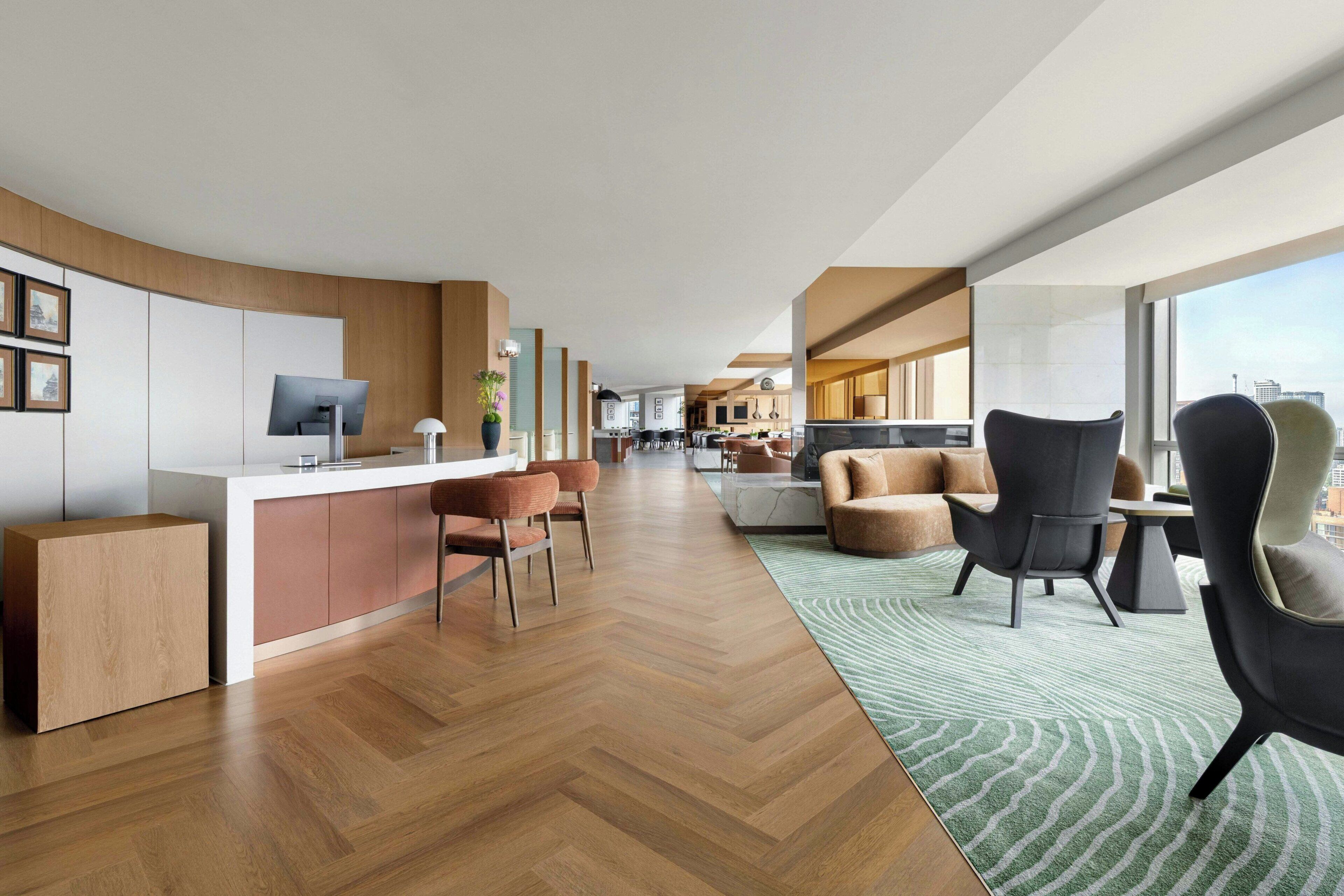 A modern interior with a kitchen, dining area, and seating space.