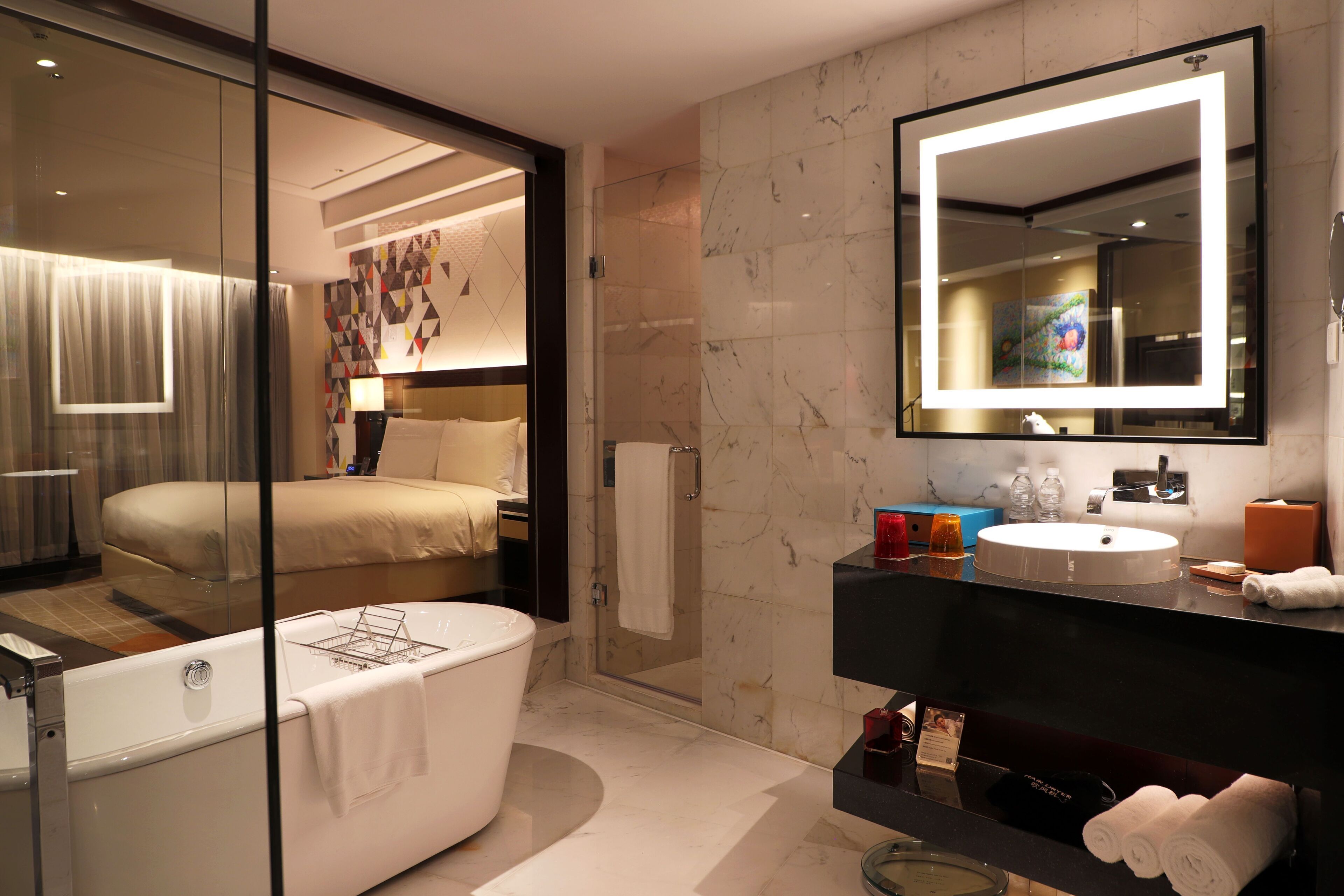 junior suite, 1 king bed | bathroom | combined shower/bathtub, deep-soaking bathtub, rainfall showerhead