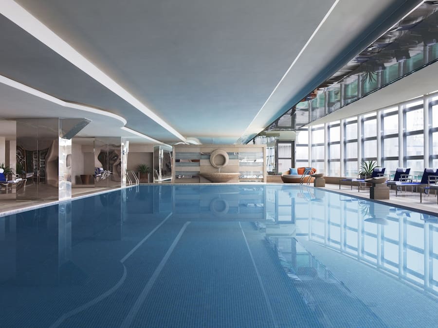 Indoor pool, open 9:00 AM to 9:00 PM, pool loungers