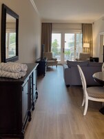 Standard Villa | Living area | 55-inch flat-screen TV with cable channels