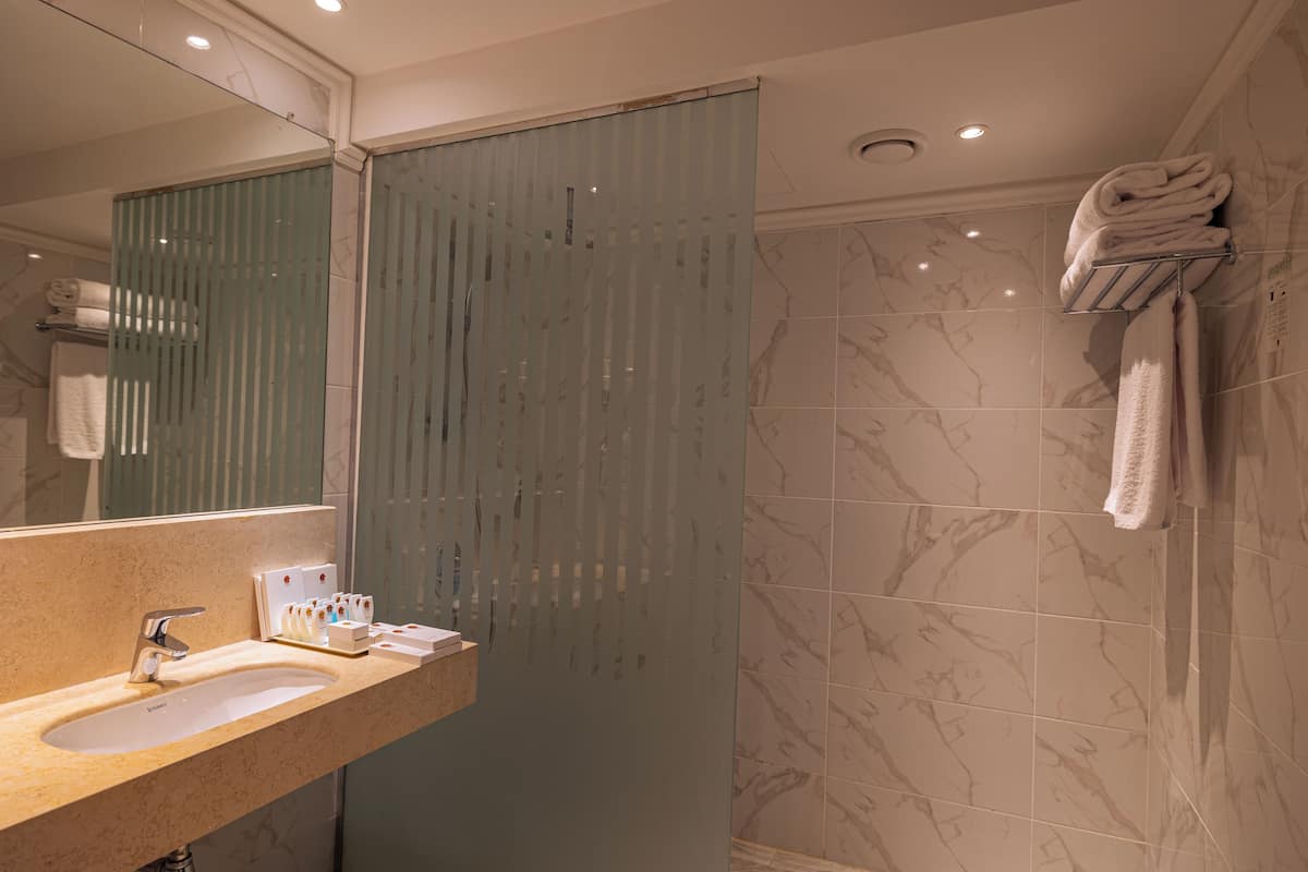 family room, 2 bedrooms, pool view | bathroom | hair dryer, slippers, towels