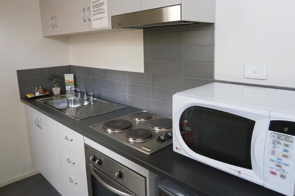 Coffee/tea maker, microwave, stovetop, cookware/dishes/utensils