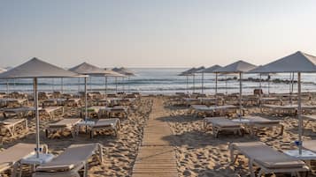 On the beach, sun loungers, beach umbrellas, snorkeling