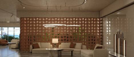 A modern lobby with a sectional sofa, a coffee table, and a decorative wooden partition.