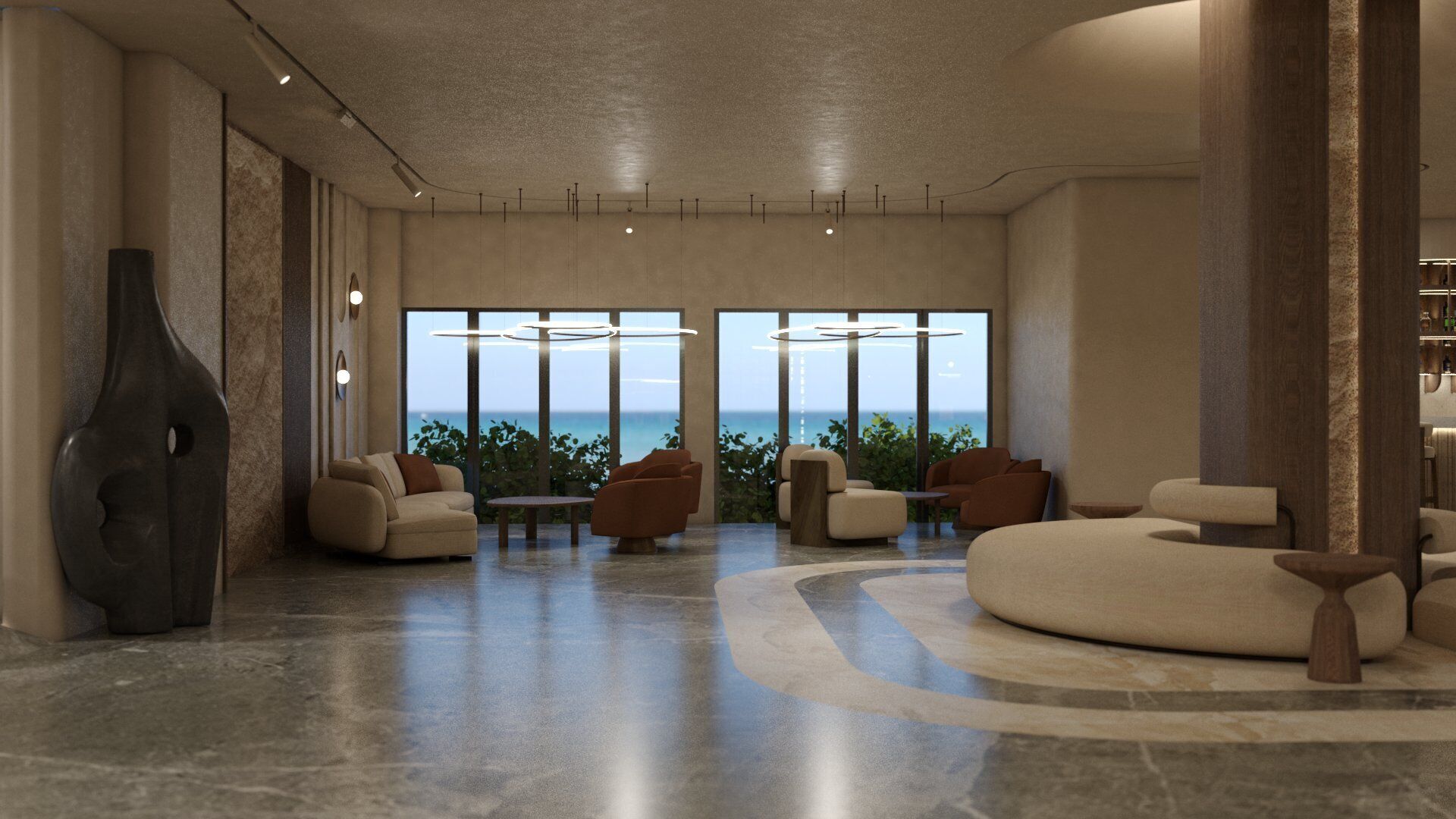 Een ruime lobby met uitzicht op zee, met een moderne zithoek met banken en fauteuils, een grote vaas en een bar.