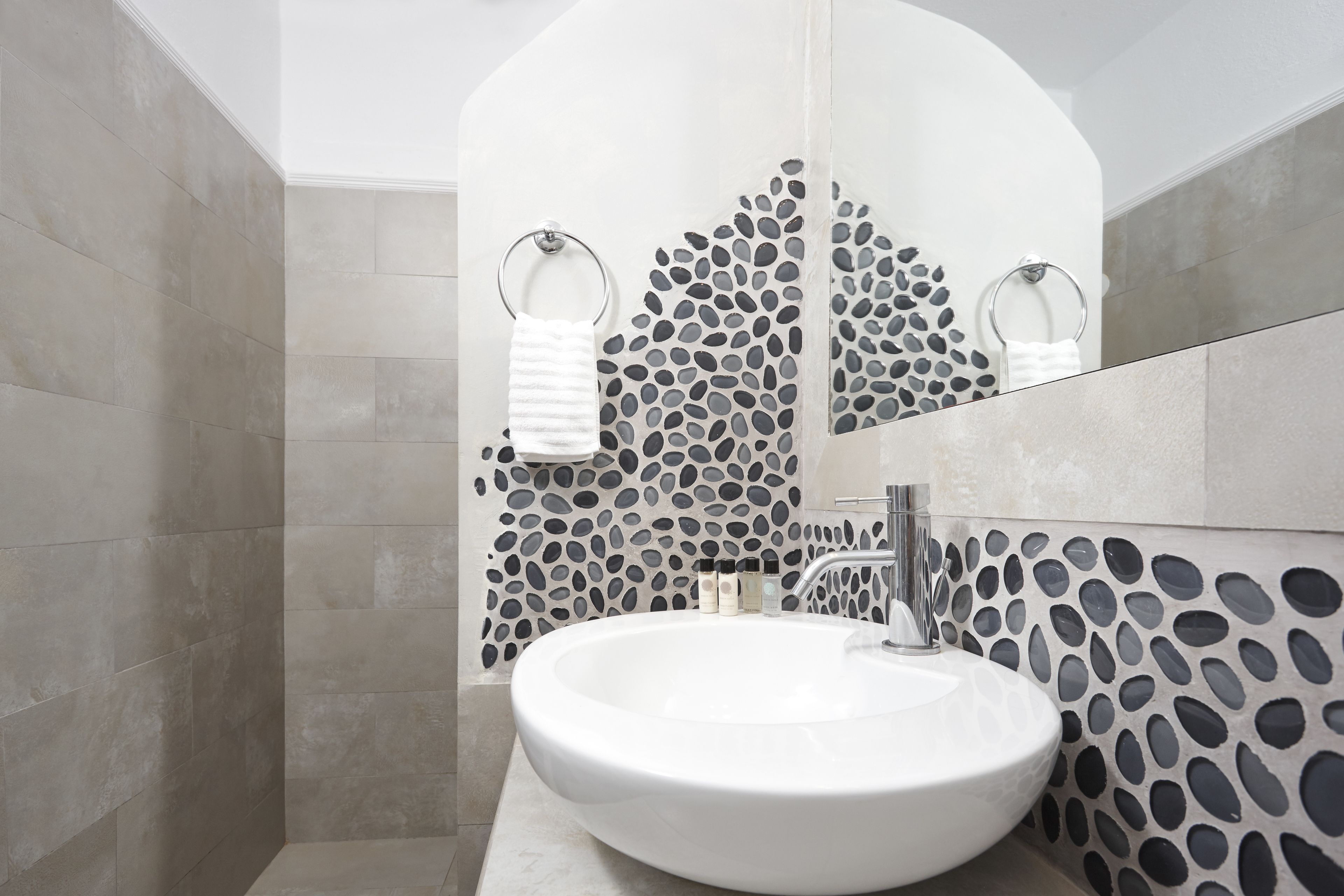 superior suite, sea view | bathroom | shower, eco-friendly toiletries, hair dryer, towels