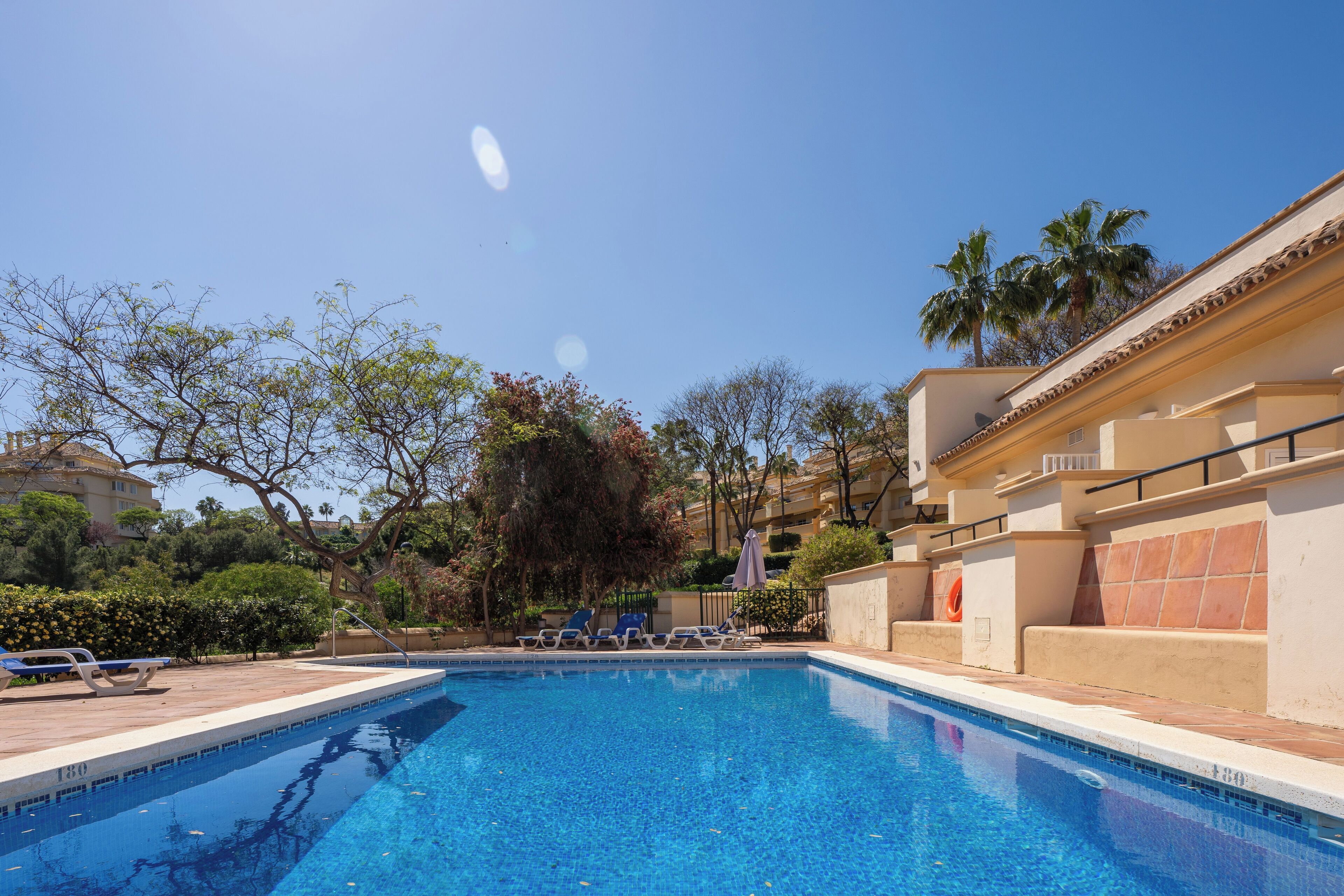 outdoor pool, open 8:00 am to 11:00 pm, pool umbrellas, pool loungers