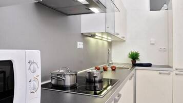 Fridge, coffee/tea maker, electric kettle, cookware/dishes/utensils