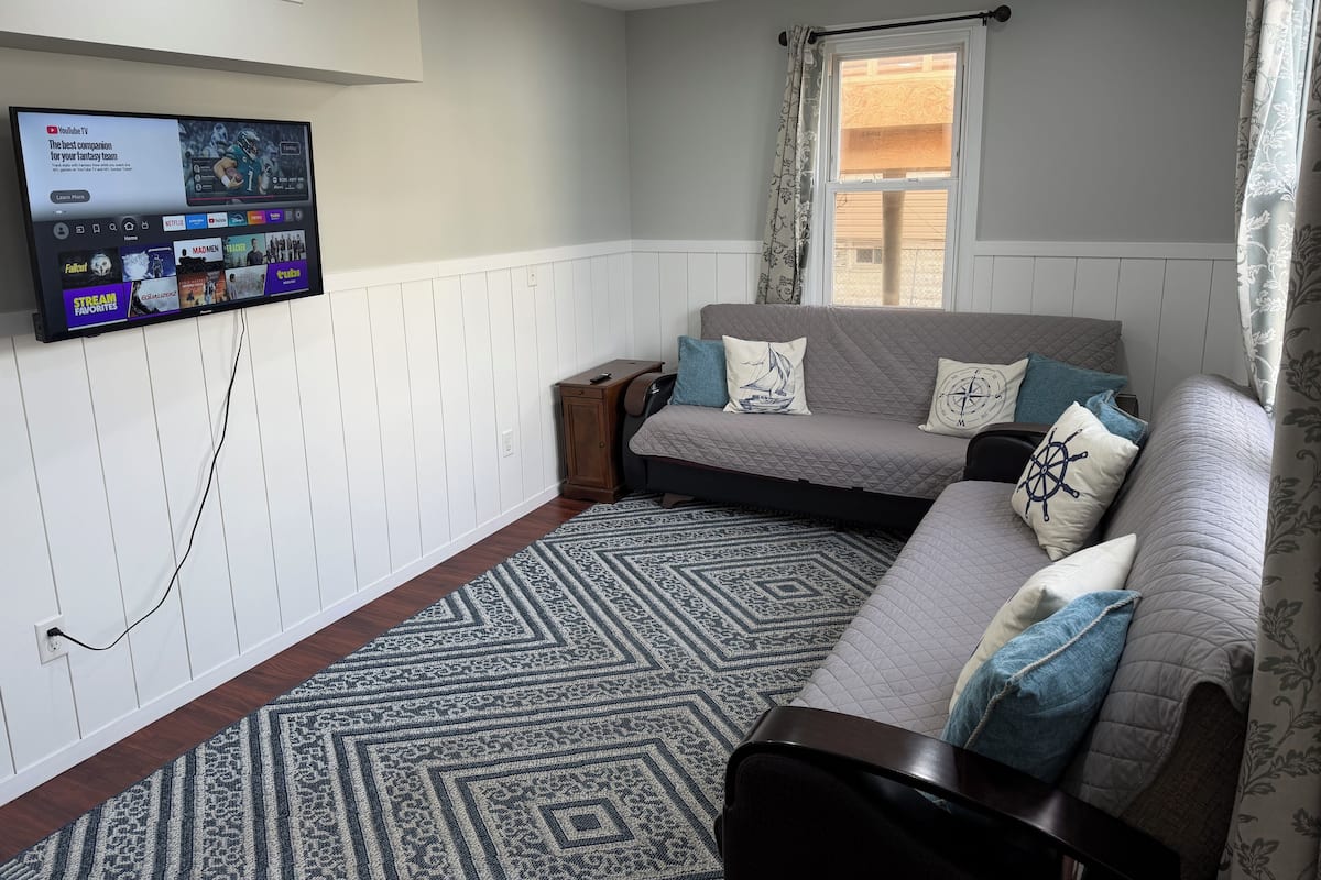 Deluxe Apartment, 2 Bedrooms, Kitchenette | Living area | 32-inch flat-screen TV with cable channels, TV