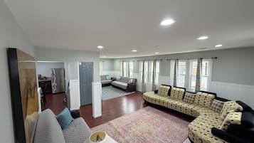 Newly Renovated 4 Bedroom Apartment | Living area | 32-inch flat-screen TV with cable channels, TV