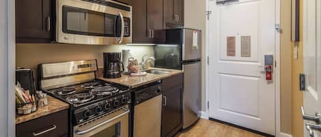 Full-sized fridge, microwave, stovetop, dishwasher