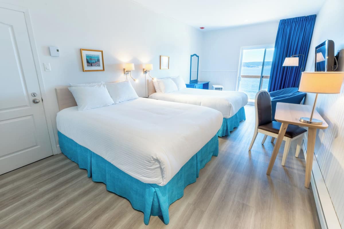 Signature Room (Bonaventure Island view) | Desk, iron/ironing board, rollaway beds, free WiFi