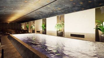 Relax by the pool surrounded by lush greenery and comfortable seating areas.