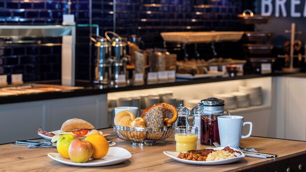 A breakfast buffet with various food items and beverages.