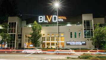 BluD Hotel & Spa offers a serene atmosphere with a focus on spa services, surrounded by lush greenery.