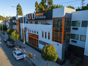 A modern hotel with a prominent 'BLVD HOTEL STUDIOS' sign, large windows, and a clean, contemporary design. - BLVD Hotel and Studios Universal-Hollywood, an Ascend Collection Hotel (Studio City)