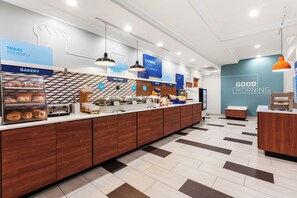 A modern breakfast area with a bakery section, a coffee station, and a sign that reads 'GOOD MORNING'. - Holiday Inn Express & Suites Klamath Falls Central by IHG (Klamath Falls)