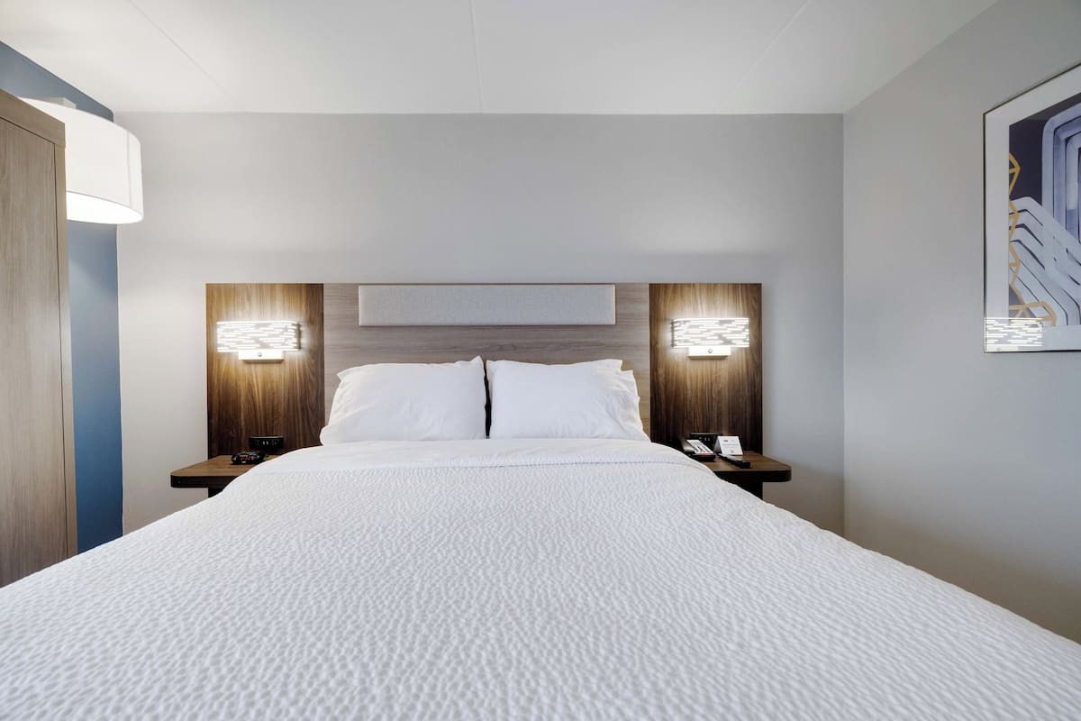 Desk, laptop workspace, blackout drapes, iron/ironing board