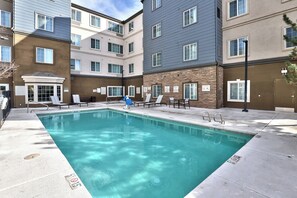 Seasonal outdoor pool, open 8:00 AM to 10:00 PM, pool loungers