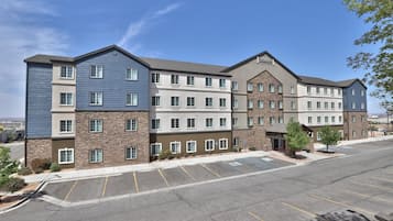 Stunning hotel building with a modern design, featuring a central entrance and balconies.