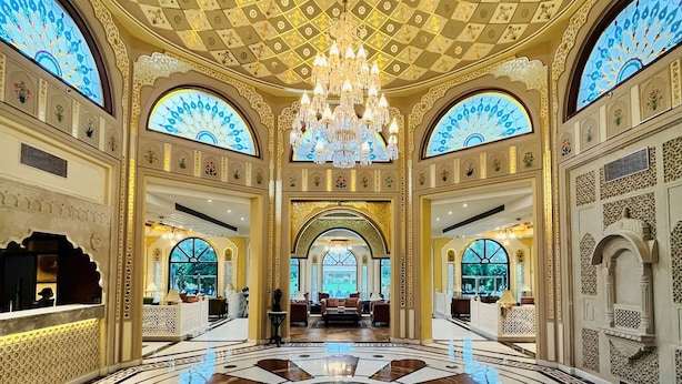 A grand lobby with a central chandelier, ornate ceiling, and a circular marble floor. - Heritage Village Resort & Spa Manesar (Gurugram)
