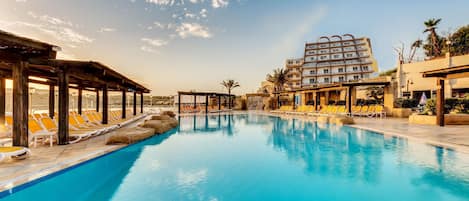 Indoor pool, seasonal outdoor pool, pool umbrellas, pool loungers