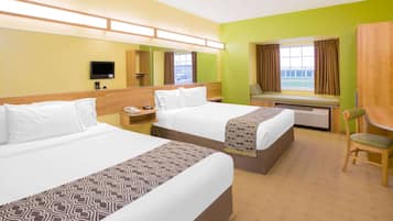 Hypo-allergenic bedding, desk, laptop workspace, blackout curtains