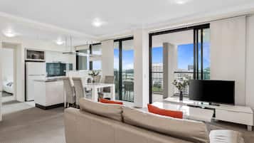 Apartment, 2 Bedrooms, 2 Bathrooms (1 Queen & 2 Single Beds) | Living area | Flat-screen TV